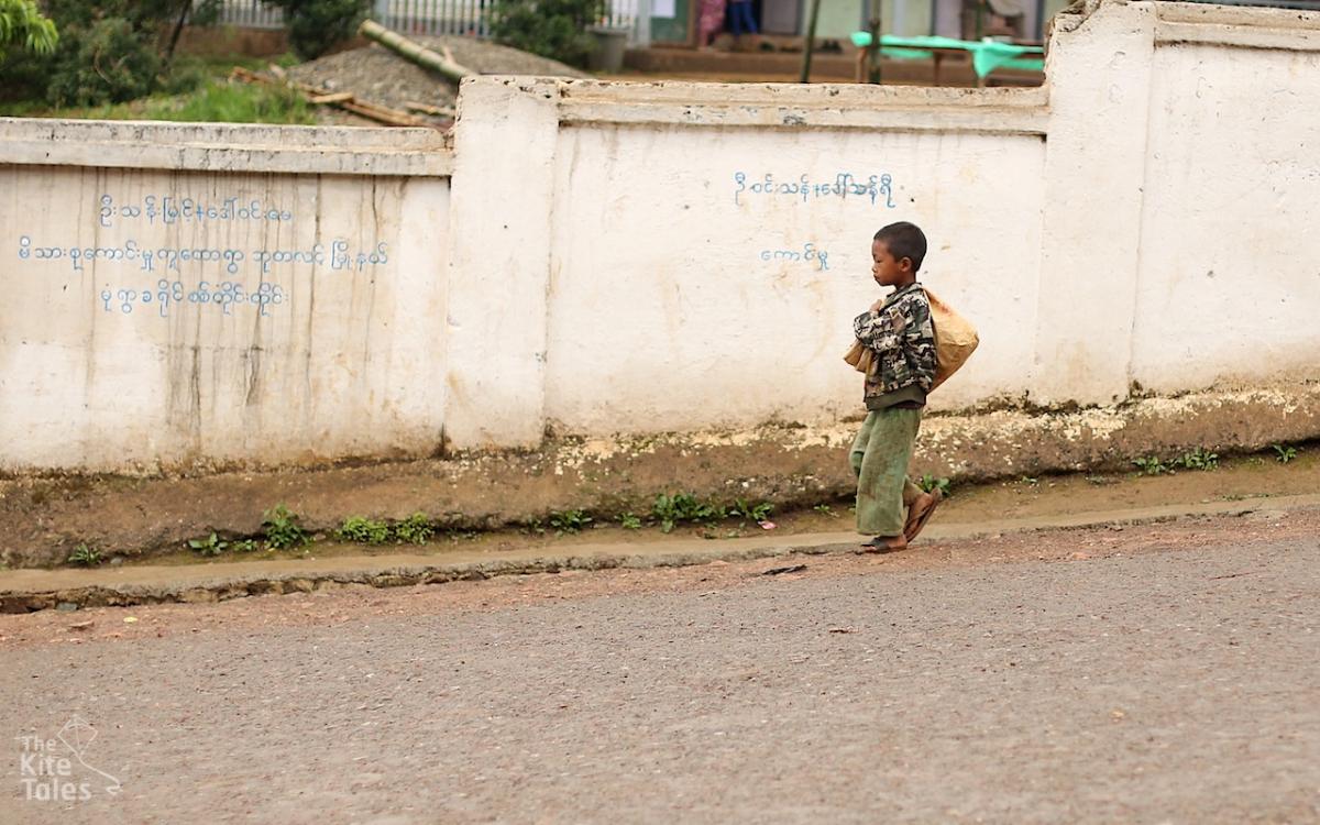A child walks down the street in downtown Lahe