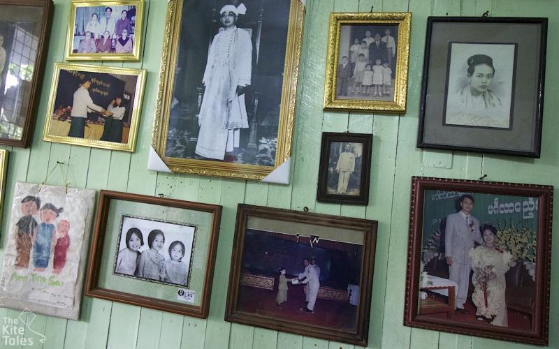 Family photo's on the wall of Haymar's house. A portrait of Sao Shwe Thaike takes the centre spot