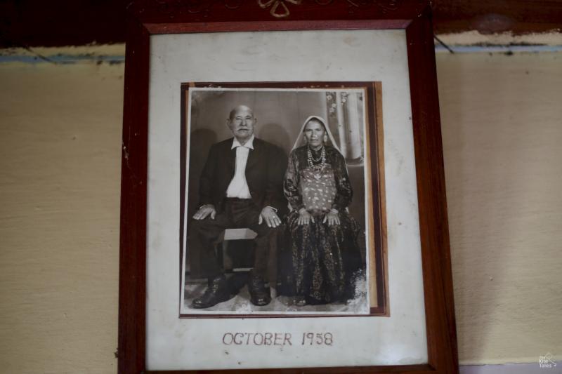 Kamella still keeps a picture of her grandparents on the wall of her home, which she shares with her elderly mother. The house was built by her father and eldest brother